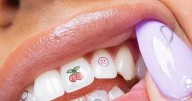 Are Tooth Tattoos the next 2025 trend? New fashion look sees engraved dental caps fitted to teeth for just £200