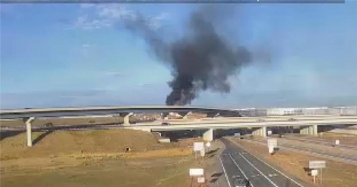 Crash and vehicle fire at westbound Interstate 70 near Colfax Avenue and E