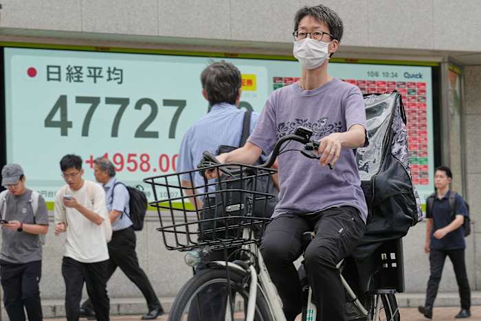 Asian shares advance and oil prices fall as Israel and Hamas agree to pause fighting