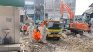 Indonesian rescuers search for missing students after school collapse kills 49