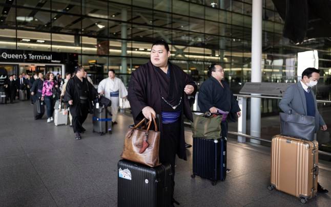 Fans warned they could be squashed by fighters during the Grand Sumo Tournament