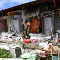 Rescuers desperately search for survivors of earthquake in the Philippines that killed at least 72