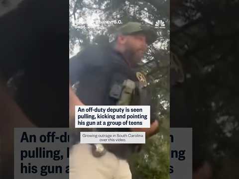 An off-duty deputy is seen pulling, kicking and pointing his gun at a group of teens