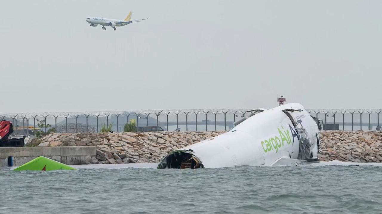 Cargo aircraft skids off Hong Kong runway, collides with security patrol car, killing 2, AP explains