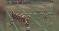 Youth football game fight caught on video