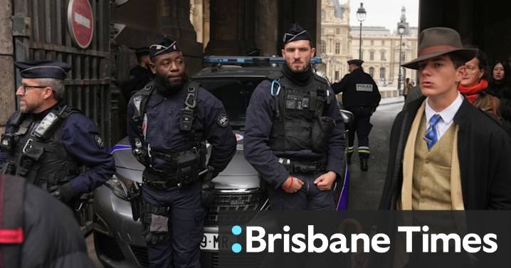 Louvre heist: Mystery man in photograph sparks online speculation