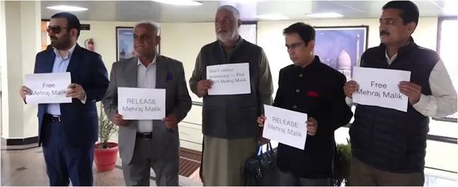 National Conference, Congress MLAs stage silent protest demanding release of AAP MLA Mehraj Malik