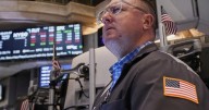 Wall Street sets more records, but bond yields drop following discouraging data on the job market