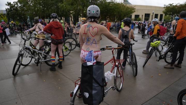Naked bike riders demonstrate against federal troops in 'quintessentially Portland' protest