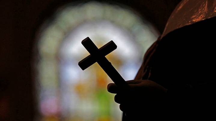 Former New Orleans Catholic priest exploited family deaths to abuse disabled boy, police allege