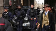 Dapper stranger in Paris crown jewels heist photo sparks online buzz