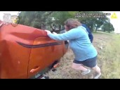Police Bodycam Video Shows Baby Rescued From Overturned Car