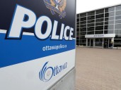 Two hurt in three-vehicle crash that included police vehicle