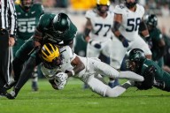 Spartans’ defense inconsistent but makes strides against Wolverines