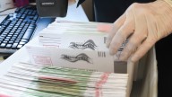 Mailing your ballot? Here's how much postage is required this year