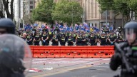 Police cop rocks, bottles as migration protesters clash