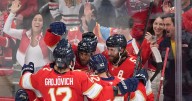 Cup champ Panthers beat Blackhawks on banner