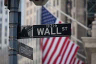 Wall Street banks toast to $130bn revenue in deal making boom