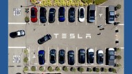 Parents of two college students killed in a Tesla allege design flaw trapped them in the burning car