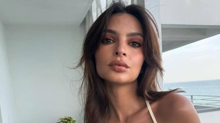 Emily Ratajkowski puts a casual twist on the naked dress trend in an oversized white tee