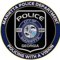 Teen shot at Marietta strip mall, police looking for suspects