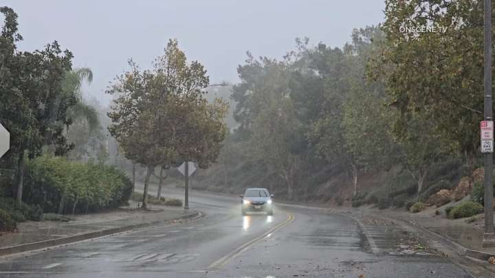 Firefighters Mount Rescue for Man Swept Down Storm Canal Amid Rainstorm in Riverside