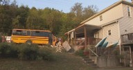 School bus driver crashes into home in Forward Township