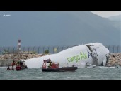 2 dead after cargo plane skids off runway and into sea at Hong Kong International Airport