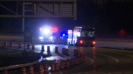 Band tour bus crashes into local construction sign