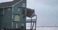 Dozens rescued as remnants of typhoon hits Alaska while nor'easter brings flooding to East Coast