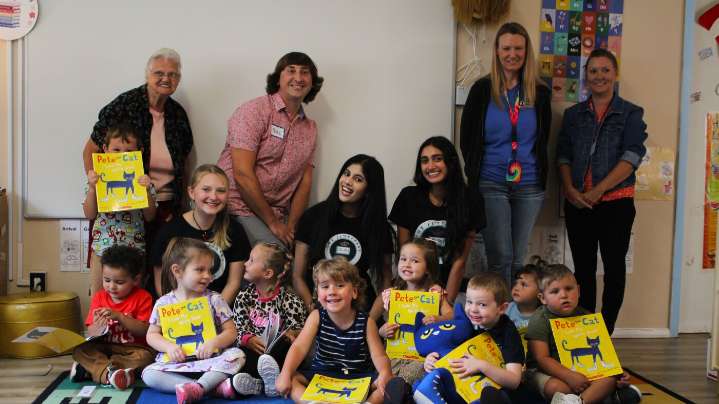 Volunteers foster literacy by reading, giving books to kids : NPR