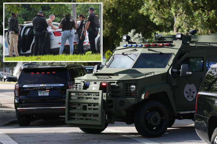 Gunman shoots two Miami cops, barricades inside house