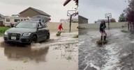 Family embraces flooding from rainstorm by backyard wakesurfing