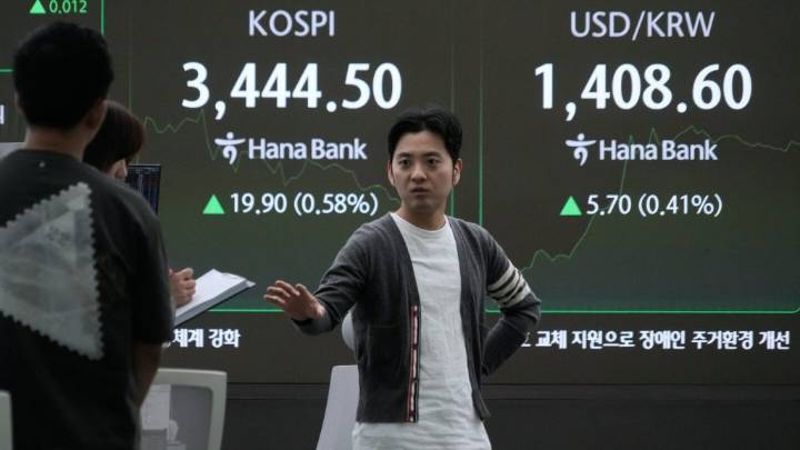 Asian shares are mixed as markets shrug off a likely US government shutdown