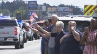 Citizens pay respect to fallen Iberville Deputy as body is escorted to Gonzales funeral home