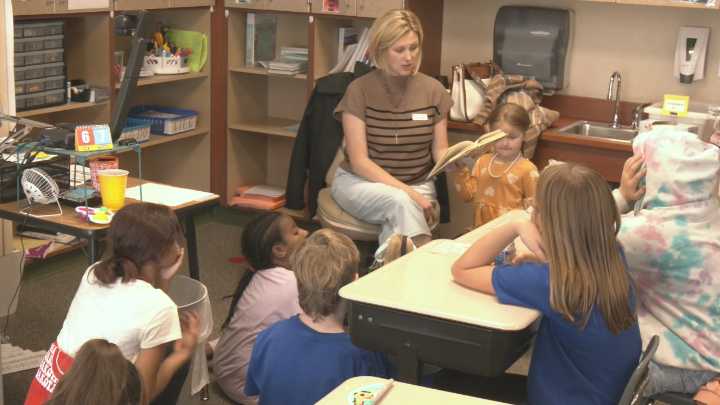 KVRR reads to fourth graders at Osgood Elementary School