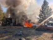 Firefighters battle RV inferno near Hwy 291