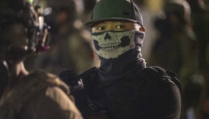 Masked immigration agents erode trust and intimidate, former top federal law officials say