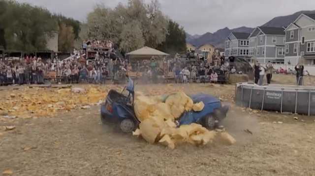 VIDEO: Utah man drops 2,000 pound pumpkin on an old car