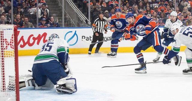 Oilers net first win with 3-1 decision over resilient Canucks