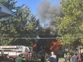Firefighters from at least 5 departments battle house fire in Clay