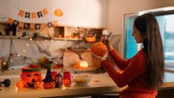 The Easy DIY That Gives Dollar Tree Wooden Ghosts A Major (& Affordable) Upgrade