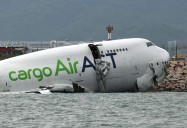 At Least 2 Dead After Plane Slides Off Runway, Crashes into Car, Plummets in Ocean