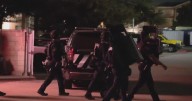 Murder charge filed after deadly Lewisville hotel standoff, police say