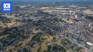 Record flooding in Vietnam kills at least eight people with the army deployed to help with recovery effort