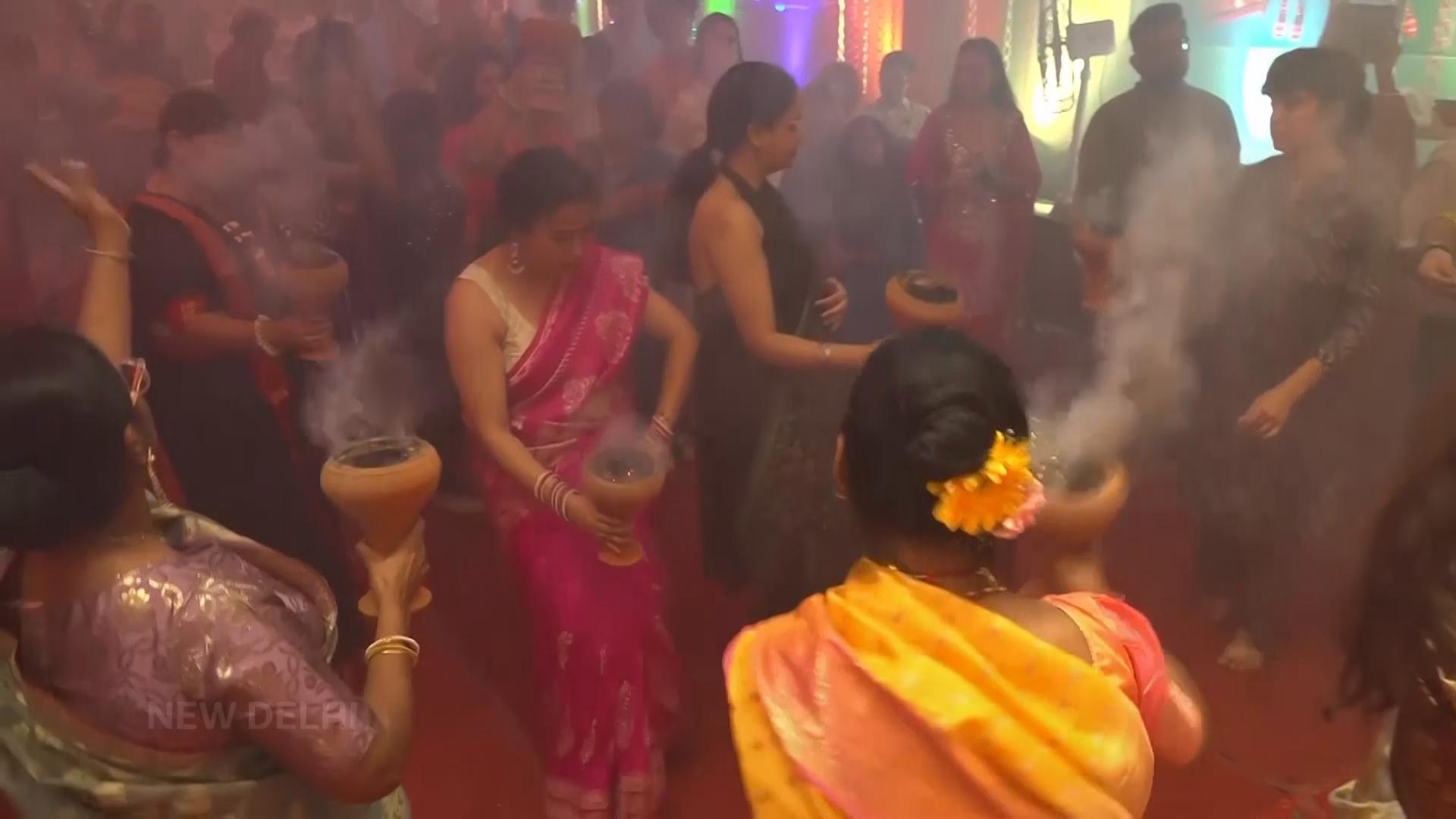 Indians celebrate Durga Puja with dancing, prayers, shopping and food
