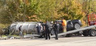 Tanker carrying sewage rolls over, car damaged in crash on State Route 422