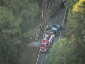 Crews work to clean up after log truck overturns in Durham County