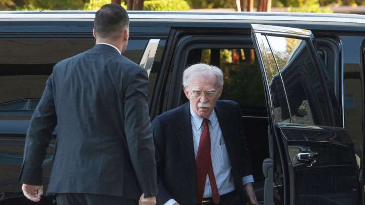 Ex Trump adviser Bolton surrenders after being indicted for mishandling classified information