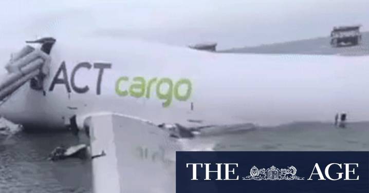 Hong Kong airport crash: Two dead as cargo aircraft skids off runway